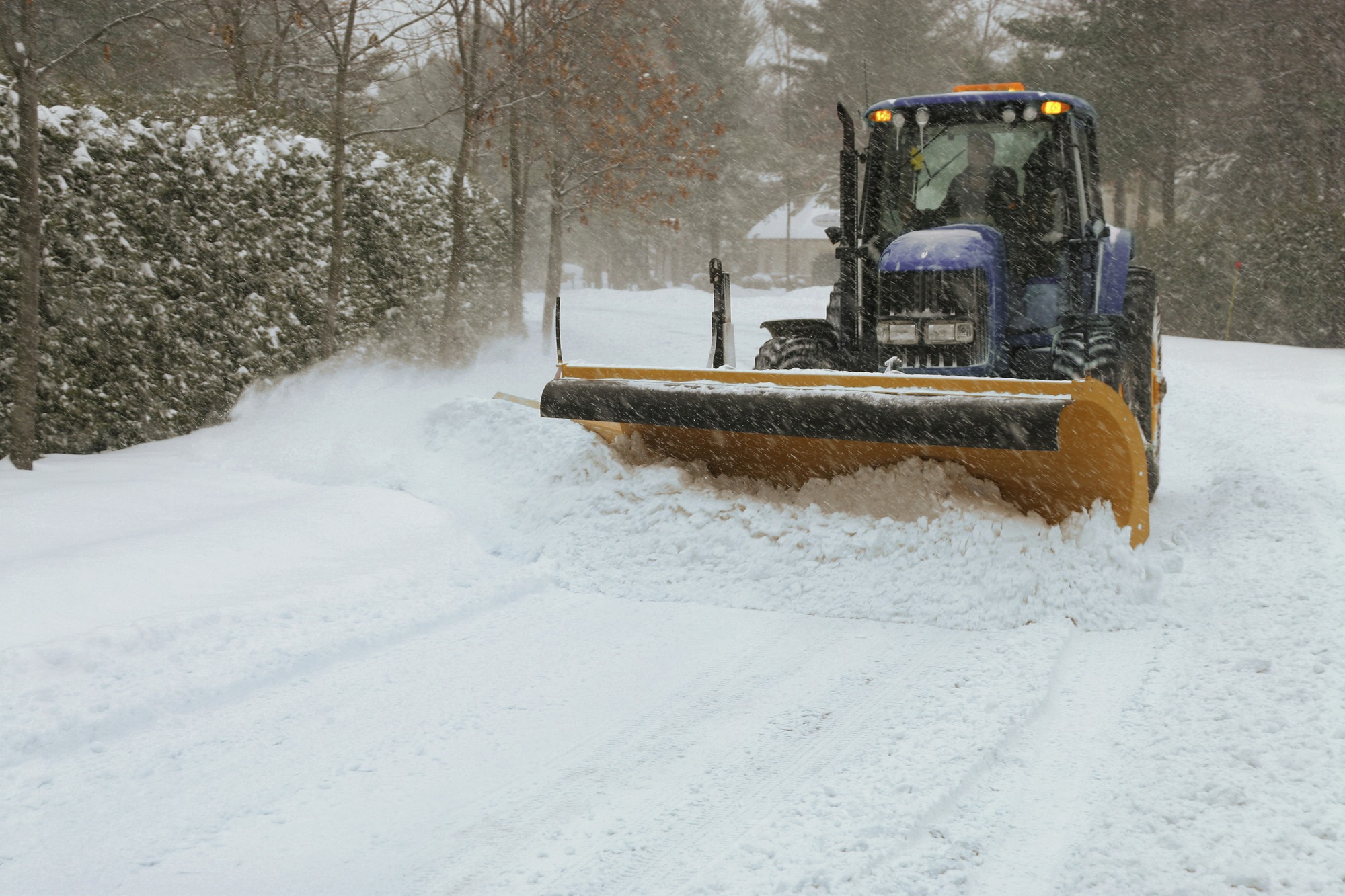 Snow plow cleaning the street