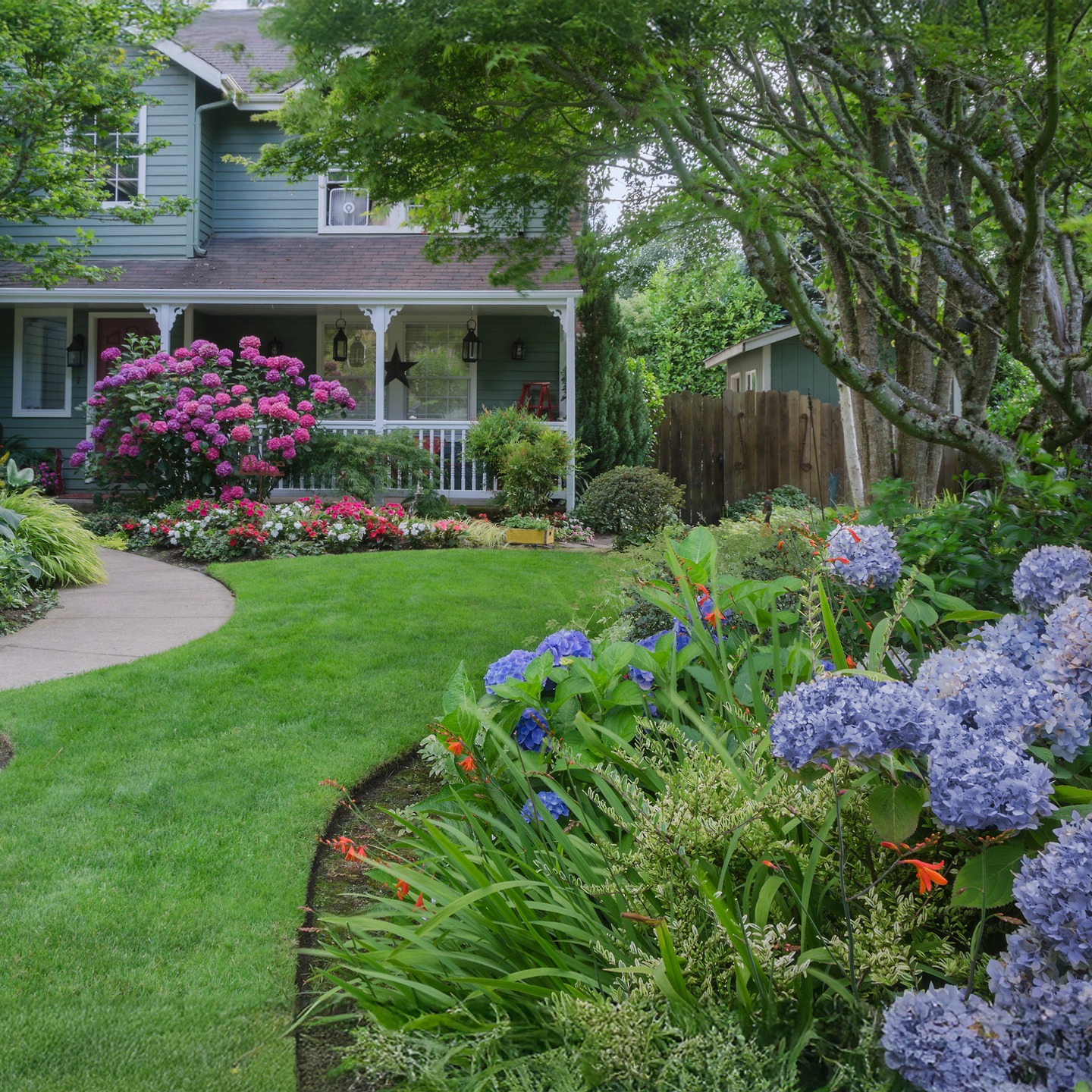 Entrance to a home through a beautiful garden